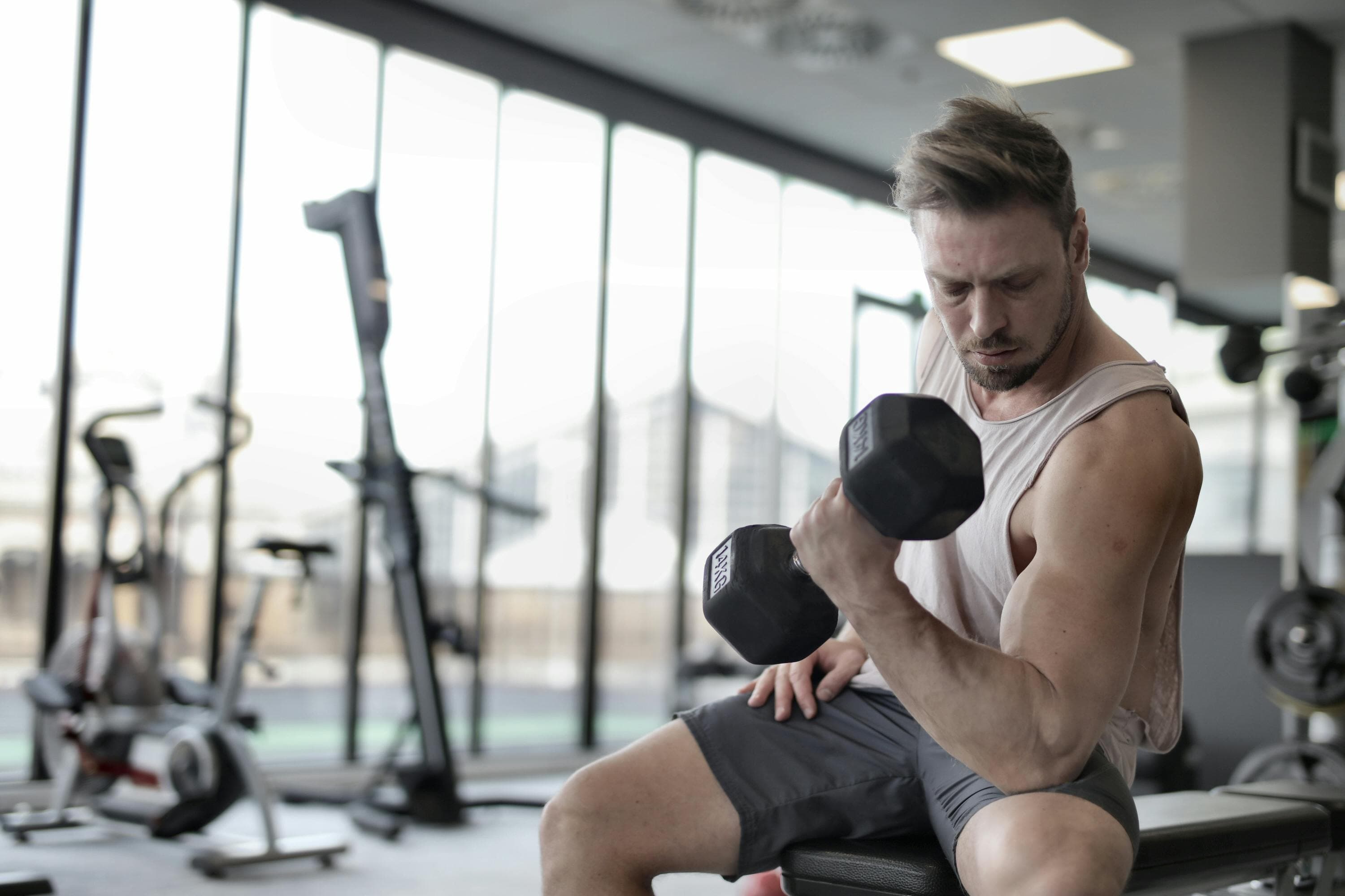 ForgeFit founder under the barbell in the garage gym